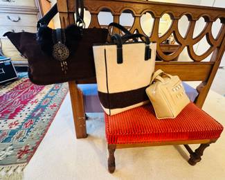 A Few of the Handbags Available Shown on the Henredon Twin Headboard/Footboard and Vintage Mahogany Footstool.  Purses Shown include a Vintage Coach Wool Stripe Oversize Shoulder Bag, a Barry Kieselstein Inspired Naugahyde Golf Themed Bag and a Brown Suede Nicole Lee Collection Purse.