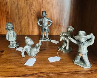 Whimsical MCM Hudson Pewter Figurines From the Littles Collection, a Signed Walli Ortman #036 Raincoat Boy and More Available in our MCM Guest Room.