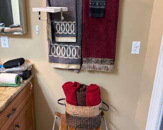 Towels , toiletries, curling iron, teak bath stool