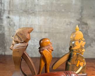 This lot features a collection of four (4) hand-carved wooden figural nutcrackers, likely made in the Black Forest region of Germany or Switzerland. These antique folk art pieces generally date back to the late 19th century or early 20th century. The tallest measures, 10” H.

