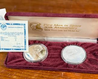 The medal on the left depicting Yuri Gagarin was minted from the metal of a space craft actually flown into space. The Proof 3 Rouble coin on the right is minted in .900 fine silver (current melt: $18.68, Book $45) and pays tribute to the Yuri Gagarin monument. Accompanied with a certificate of authenticity and comes in the original presentation case.

