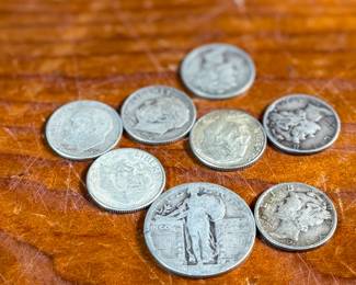 This lot features a collection of silver dimes, mercury dimes, and a silver quarter with a .95 cent face value.

