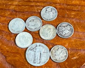 This lot features a collection of silver dimes, mercury dimes, and a silver quarter with a .95 cent face value.

