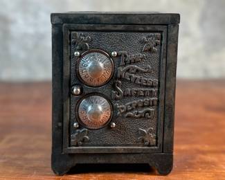 This lot features an antique cast iron bank known as, “The Keyless Safety Deposit Box”. Locks and unlocks as it should and measures, 6” H x 4.5” W x 4” D.


