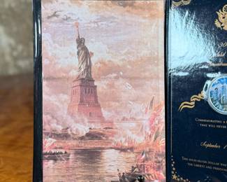 This lot features a 2001 Solid Silver Remembrance Dollar, containing one (1) troy ounce of .999 fine silver. It is a United States commemorative coin minted in 2001.

