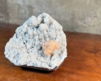 This lot features a stunning Peach Stilbite cluster on a White Zeolite matrix. This specimen measures, 3.5” H x 8.5” W x 8” D. A "Peach Stilbite Cluster on White Zeolite Matrix" is a beautiful natural mineral specimen featuring delicate, radiating blades of peach-colored stilbite (a zeolite) growing on a contrasting white mineral matrix, often basalt or heulandite, typically from India, prized by collectors for its visual appeal and believed gentle, calming energies for spiritual growth.

