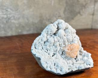 This lot features a stunning Peach Stilbite cluster on a White Zeolite matrix. This specimen measures, 3.5” H x 8.5” W x 8” D. A "Peach Stilbite Cluster on White Zeolite Matrix" is a beautiful natural mineral specimen featuring delicate, radiating blades of peach-colored stilbite (a zeolite) growing on a contrasting white mineral matrix, often basalt or heulandite, typically from India, prized by collectors for its visual appeal and believed gentle, calming energies for spiritual growth.

