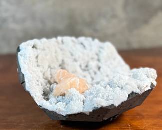 This lot features a stunning Peach Stilbite cluster on a White Zeolite matrix. This specimen measures, 3.5” H x 8.5” W x 8” D. A "Peach Stilbite Cluster on White Zeolite Matrix" is a beautiful natural mineral specimen featuring delicate, radiating blades of peach-colored stilbite (a zeolite) growing on a contrasting white mineral matrix, often basalt or heulandite, typically from India, prized by collectors for its visual appeal and believed gentle, calming energies for spiritual growth.

