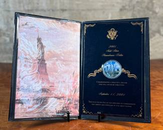 This lot features a 2001 Solid Silver Remembrance Dollar, containing one (1) troy ounce of .999 fine silver. It is a United States commemorative coin minted in 2001.

