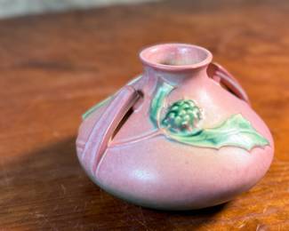 This lot features a Roseville Pottery "Thornapple" vase in a pink glaze that measures, 4.5” H x 6.5” W x 6.5” D. It comes in very good condition and is marked, "808-4" on the bottom. The Thornapple pattern was introduced by Roseville Pottery in 1937.

