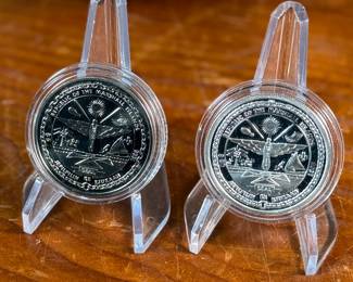 This lot features a John Glenn Returns to Space Commemorative Coin Set that includes a $50 .999 fine silver coin, along with a $5 solid cupronickel coin, circa 1998. Comes in the original presentation case with a certificate of authenticity. It commemorates John Glenn’s historic 1998 space shuttle flight aboard the Discovery (STS-95), when he became the oldest person to fly in space. 

