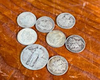 This lot features a collection of silver dimes, mercury dimes, and a silver quarter with a .95 cent face value.

