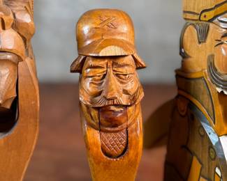 This lot features a collection of four (4) hand-carved wooden figural nutcrackers, likely made in the Black Forest region of Germany or Switzerland. These antique folk art pieces generally date back to the late 19th century or early 20th century. The tallest measures, 10” H.

