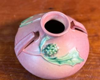 This lot features a Roseville Pottery "Thornapple" vase in a pink glaze that measures, 4.5” H x 6.5” W x 6.5” D. It comes in very good condition and is marked, "808-4" on the bottom. The Thornapple pattern was introduced by Roseville Pottery in 1937.


