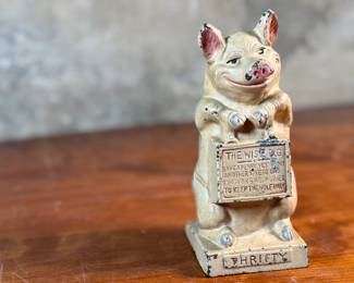 This lot features a J.M.R. Hubley No. 82 cast iron “Thrifty Wise Pig” piggy bank that measures, 6.5” H.

