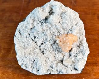 This lot features a stunning Peach Stilbite cluster on a White Zeolite matrix. This specimen measures, 3.5” H x 8.5” W x 8” D. A "Peach Stilbite Cluster on White Zeolite Matrix" is a beautiful natural mineral specimen featuring delicate, radiating blades of peach-colored stilbite (a zeolite) growing on a contrasting white mineral matrix, often basalt or heulandite, typically from India, prized by collectors for its visual appeal and believed gentle, calming energies for spiritual growth.

