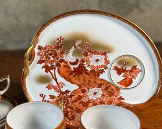 
This lot features a beautiful Japanese Kutani porcelain tea and snack set. The set features a vibrant, hand-painted design with a peacock and peonies motif. 

It is made of delicate "eggshell" porcelain. The entire set comes in excellent condition and includes six (6) cups and plates.
