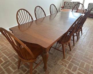 Solid wood table, includes TWO leaves and EIGHT chairs. **We have TWO sets like this, the other is n the previous pic!**