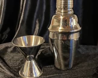 Double liquor measuring cup, stainless, $4.  Stainless cocktail shaker, $8