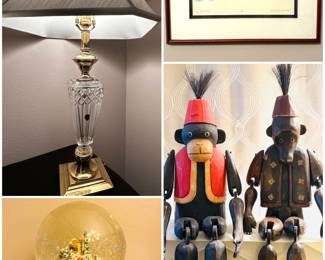  A Waterford Crystal Lissadel table lamp, a Vintage 7" Department 56 Village Musical Snow Globe, a 1991 color etching print titled "Midwinter" by American artist Anita Jones Stanton and a pair of vintage hand-carved wooden monkey figurines. 