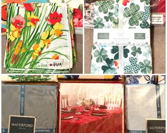 A collection of vintage Vera Neumann floral linens. A Rachel Ashwell St. Patrick's Day Rainbow Green Clover Tablecloth and a collection of brand new Waterford table linens. 