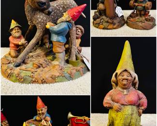 A collection of Tom Clark gnomes, including the "Spring Cleaning" figurine. 