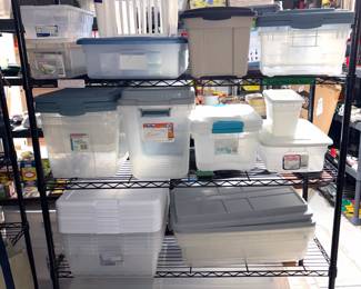 Collection of plastic storage containers including Hefty and Sterilite.