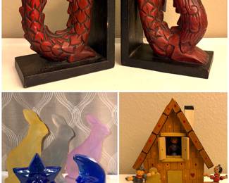 A set of vintage hand-carved wooden Asian dragon bookends, a set of vintage cobalt blue glass celestial votive candle holders, glass bunny figurines and a vintage Reuge Hansel and Gretel wooden chalet music box. 