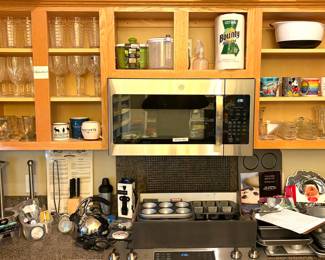 Collection of Waterford crystal glassware, Mickey Mouse mug and an assortment of baking sheets.