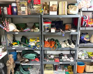 Outdoor statues, garden hoses, extension cords, American flags, light timers and a Coleman Classic Recharge 400 Lumens LED Lantern. 