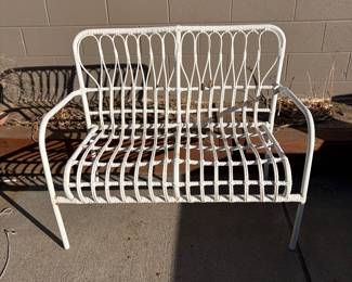 White metal and faux rattan outdoor two-seater bench. Wide variety of new and like new outdoor patio cushions also available for sale. 