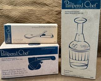 Boxed Pampered Chef Kitchen Tools, including Small Serving Tongs, Deluxe Cheese Grater and Food Chopper