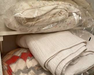 Quilts, Bedspreads, and Blankets. Several I haven’t sorted yet