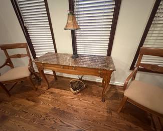 . . . marble-topped table with accent chairs