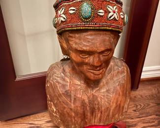 . . . great carved bust with beaded hat