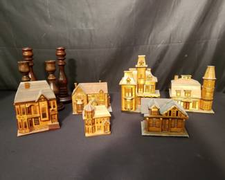 Group of wood candlesticks and house models trinket boxes.