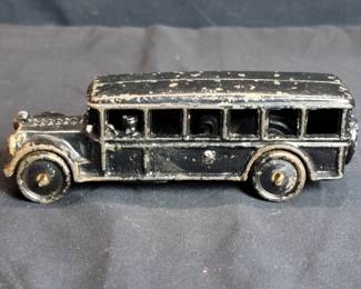 Vintage cast iron bus toy