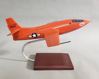 Bell X-1 model rocket plane on wood and metal