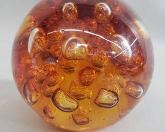 Amber glass sphere paper weight