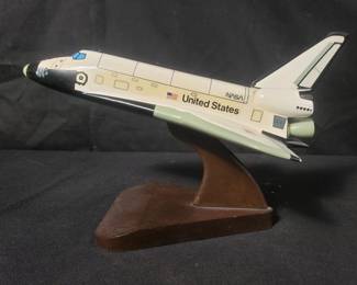 Nasa space shuttle orbiter wood model on wooden stand