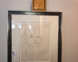 #53/250 Lithograph by Henri Matisse titled Hier, de tes Doigts d'or pale. The title translates to "Heir, of your Pale Golden Fingers". It is a plate from the portfolio Poésies Antillaises, which features poems by John-Antoine Nau. The original drawing was created in 1946, and the lithograph was printed in brown ink on Arches paper in 1972