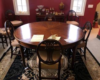 Beautiful pie crust top antique English or French dining table & a set of 8 antique inlaid chairs with good quality neutral upholstery 