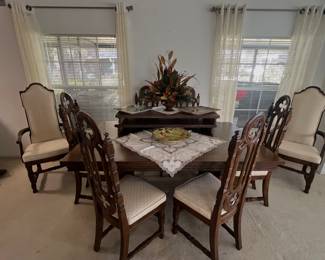Stanley Gothic style dining room table with 6 padded seat chairs, 2 armed captains chairs,2extra leaves as well as Table pads. Matching China cabinet sold separately