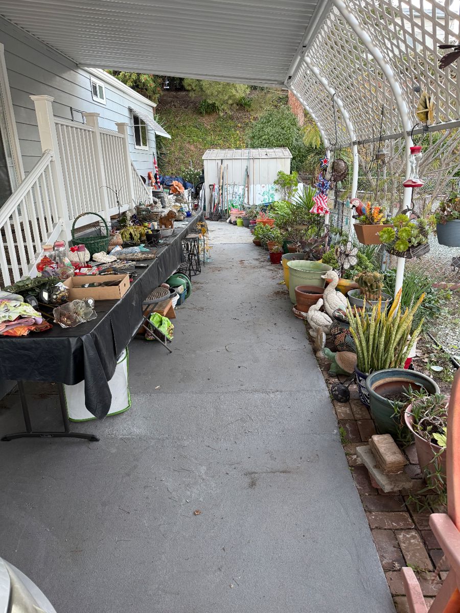 Garden decor, plants and tools.  Plant Stands and pottery.