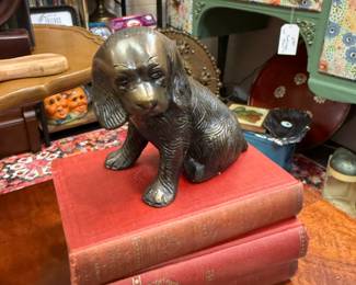 vinage brass cocker spaniel figurine, vintage books, tiered table, book shelves