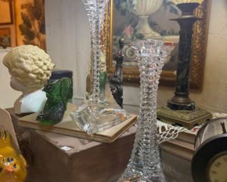 vintage crystal candlestick holders featuring a stacked triangular taper design