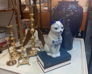 vintage brass candlesticks, blue and white cat figurine, large blue vase, vintage books
