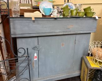 vintage painted wood sideboard with open top covered with glass and lower cabinet