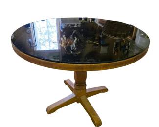 Wooden Pedestal Table with a Black Glass Top