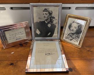 a collection of autographed photos and letters from Bette Davis